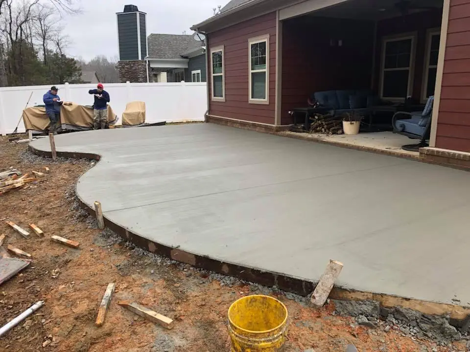 Fresh concrete patio installation in progress showing professional workmanship